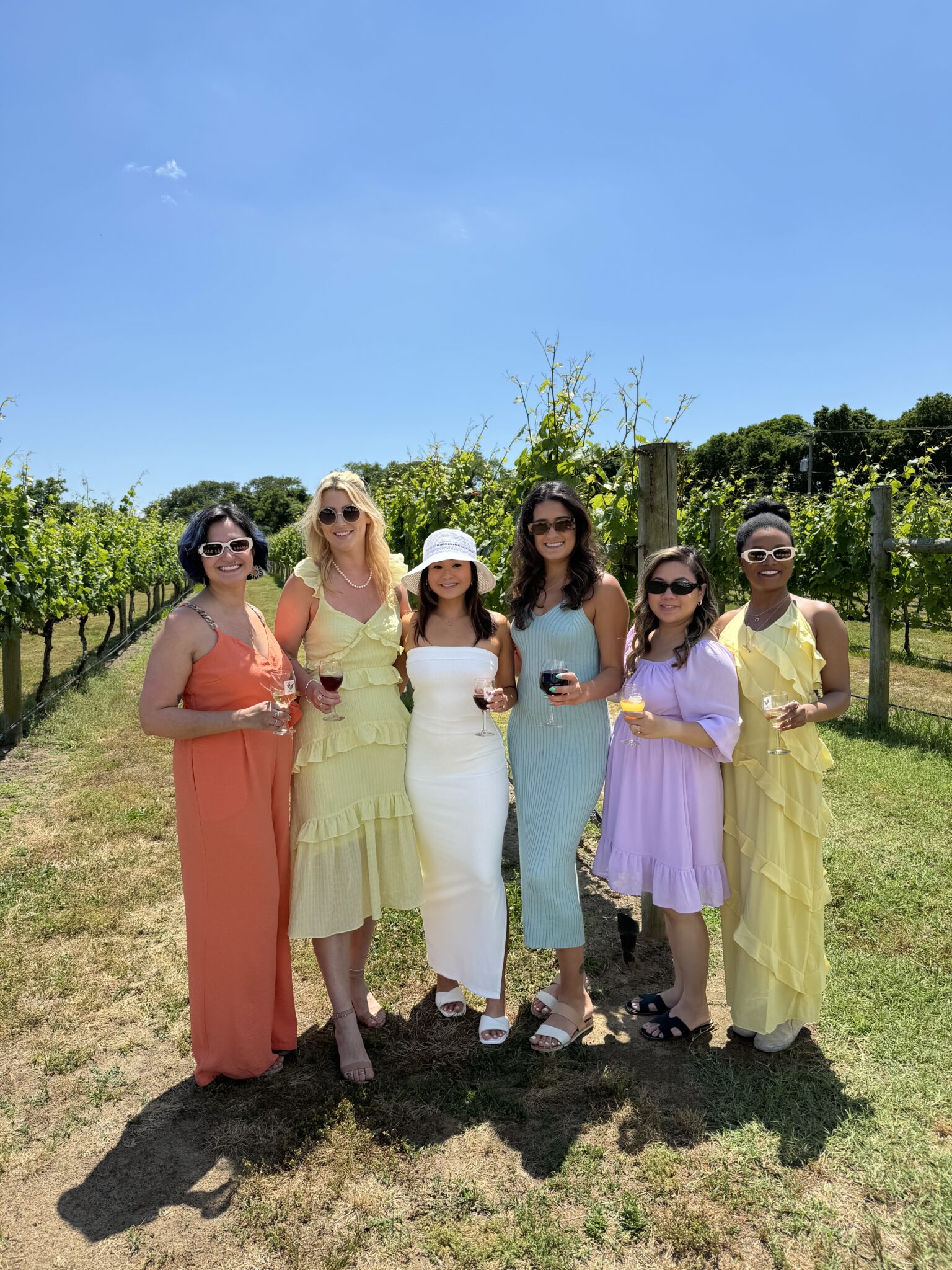 Group of women friends celebrating in a Temecula vineyard