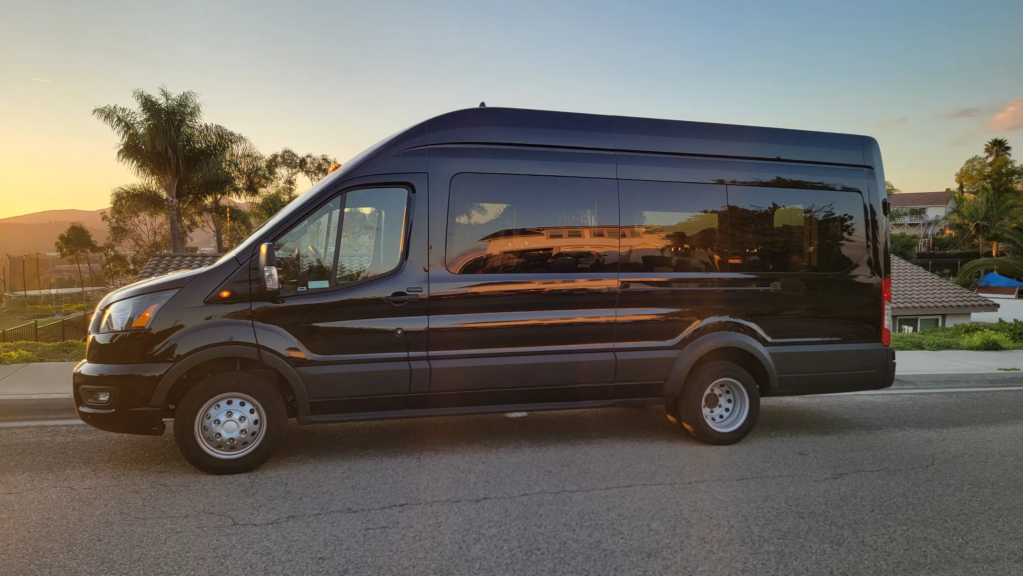 Coastal Sip Tours luxury high-roof touring van at sunset in Southern California